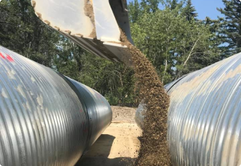 bucket dumping dirt